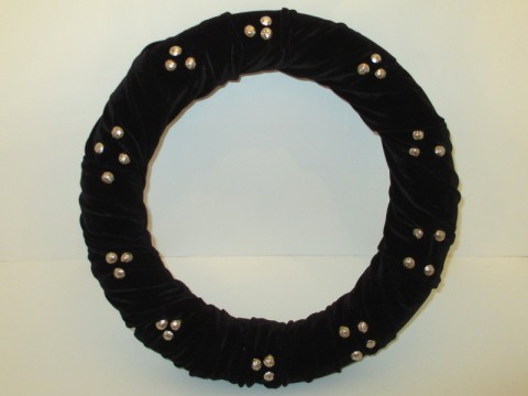 Black wreath with thumbtacks